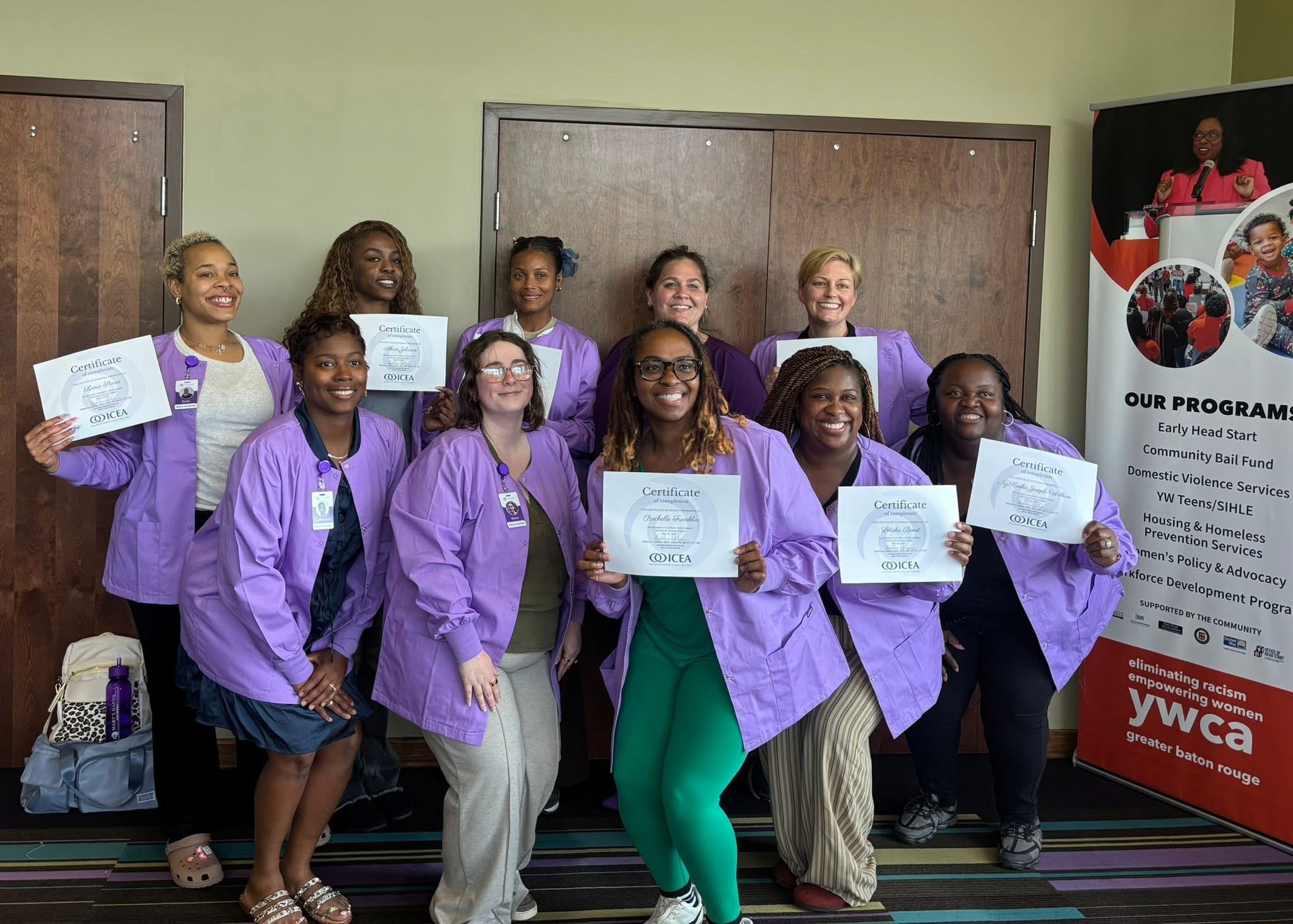 The Pi class, Maddy&rsquo;s most recent birth doula cohort, holding their ICEA certificates